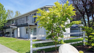 Exterior Maple Crossing Residential Building, Meticulous landscaping, Photo taken on a sunny day.